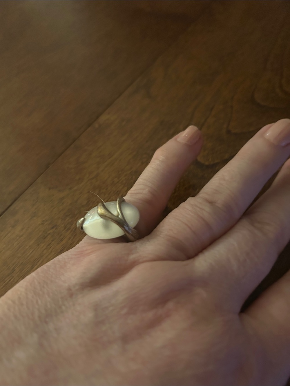 Elegant White Stone Ring with Gold-Tone Vine Setting